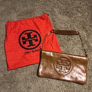 Tory Burch Reva clutch in cognac leather.